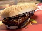 The McRib is coming back to select McDonald's despite its 2022 farewell tour. Here's a look at the iconic sandwich's history.