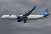 A United flight u-turned over the Atlantic coast when a passenger's laptop fell through a gap into the plane's hold