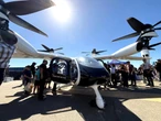Flying taxis take flight in front of a US crowd for the first time as 2 companies race to take on passengers