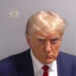 Donald Trump says he'll sell you a piece of the 'priceless' suit he wore in his mugshot &mdash; but make sure to read the fine print