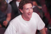 Mark Zuckerberg wishes America a happy birthday while surfing in a suit with beer and flag in hand