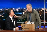 Jon Stewart defended his friend, Stephen Colbert, in an f-bomb filled monologue against CBS and the Trump administration