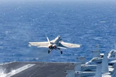 US Navy Super Hornets launched history's 'largest airstrike' from an aircraft carrier &mdash; 125,000 pounds of munitions, admiral says