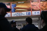 Costco's $1.50 hot dog combo is 'safe,' new CFO says. Here are the hoops the company jumps through to keep prices low on things like chicken and eyeglasses.