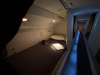 See inside the hidden area where Qatar Airways flight attendants sleep on long-haul Boeing 777 flights