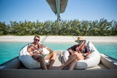 An ex-'Below Deck Med' cast member now crews a private luxury yacht in the Bahamas with her boyfriend. They work 16-hour days, but say it's the best hospitality job they've ever had.       