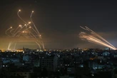 Dramatic video of a passenger plane landing at Tel Aviv airport amid a barrage as Iron Dome missiles fought off Hamas rockets   