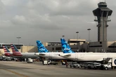 Cabin crew put out a fire after a portable charger caught alight on a flight from Florida to the Bahamas