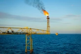The United Arab Emirates pursued nearly $100 billion worth of oil and gas deals the same year it led the global climate summit, analysis finds 