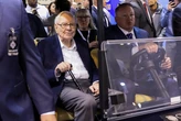 Warren Buffett's departure news stunned his Omaha gathering. His followers told me they were sad but grateful.