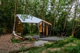 This isn't your basic tiny home. It looks like a spaceship and comes with a sauna. See inside.