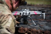 Video captures the US Army's first-ever test of grenade-dropping drones. They bombed vehicle targets.