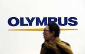 The CEO of optics giant Olympus has resigned after accusations he bought illegal drugs, sending its shares plummeting