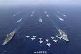 China's navy flexed new muscles in the South China Sea with its first dual aircraft carrier drills