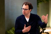 Anthropic CEO says an 'intrinsic' feature of AI may be fewer jobs. His answer? Redistribute the upside.