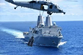 Crews have been fighting flames aboard USS New Orleans, a US Navy amphibious warship that caught fire in Japan