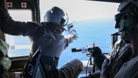 US Marines launched a drone from a moving helicopter to scout a ship for a special operations boarding team