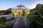 Take a tour of this futuristic spinning glass house that just hit the market in New Zealand for $665,000 