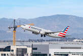 An American Airlines plane was engulfed in plumes of black smoke after an 'engine-related issue' at Denver airport