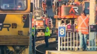 Rail worker trapped in machine at busy train station
