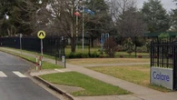 Pedestrian hit at marked crossing outside school fighting for life