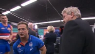 Luke Beveridge caught in awkward scenes as Roaming Brian drops in