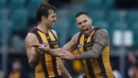 Hawks midfielder airlifted to hospital for emergency surgery