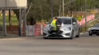 Man clings to bonnet in shocking road rage incident