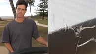 Surfer thrown from board in terrifying shark encounter