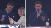 ‘Gross’ TV reporter under fire for picking up woman live on air