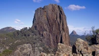 Climber concussed by falling rock stranded on 150m-high ledge