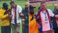 Imposter arrested after joining AFL grand final celebrations