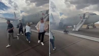 Passengers forced to evacuate from plane onto runway after landing