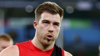 Captain meets rival coach as Essendon gets torched for ‘strange’ act