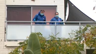 Manhunt underway after man falls to death from unit balcony