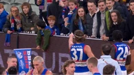 Fan clashes with Bulldogs player in ugly end to AFL thriller