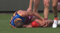 Crowd falls silent as respected defender goes down in pain