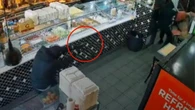 Chilling moment masked men storm kebab shop and open fire
