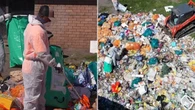 Heavy machinery and hazmat crews called in to clear backyard rubbish tip