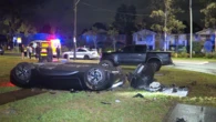 Driver crawls out of flipped BMW wreckage