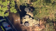 Army vehicle flips in crash with car