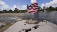 Crews comb flood-stricken Texas for 170 missing people