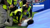 Protester stopped as Iran battle to shock draw at World Cup