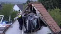 Car flies into barn roof after veering into yard and hitting little boy in Germany