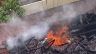 Mum flees her burning home after son allegedly sets it on fire over school fees