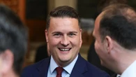 UK minister quits and calls for contest to oust prime minister