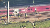 One killed and dozens injured as trains collide in UK