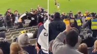AFL fans marched out of MCG after fists thrown in violent scene
