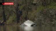 Tragic scenes as ute where father and son died in river crash dredged from river