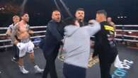 Blockbuster fight descends into chaos as trainer punched in the face